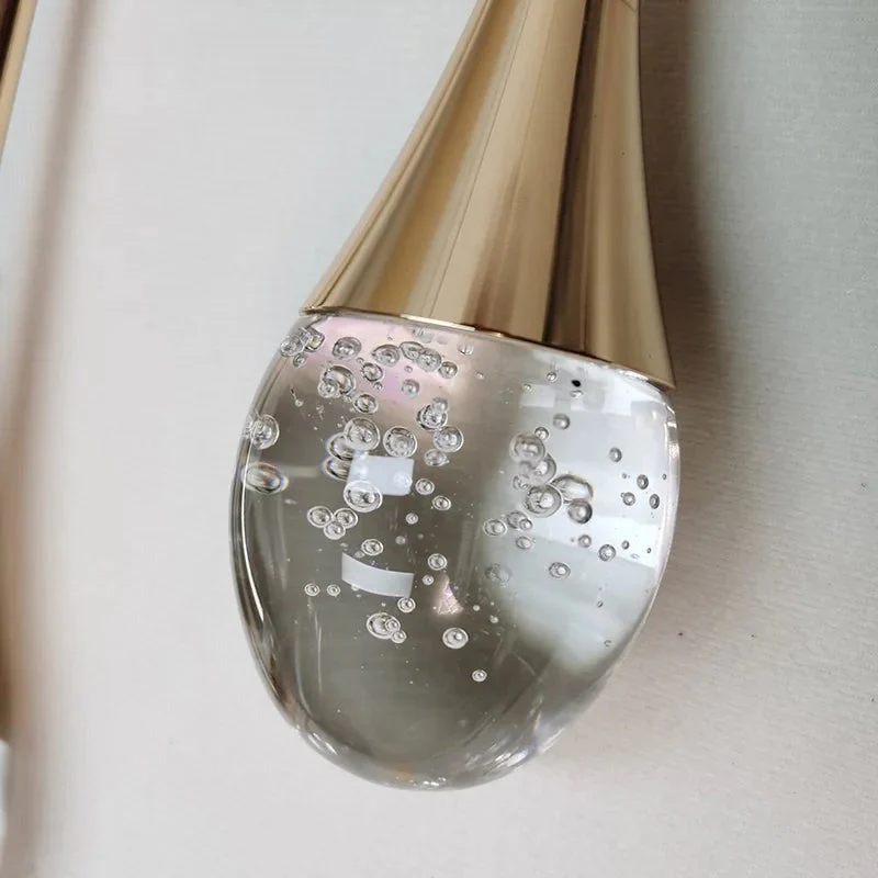 Modern LED Wall Light with Teardrop Glass Pendant and Gold Accent �C Warm Ambient Glow